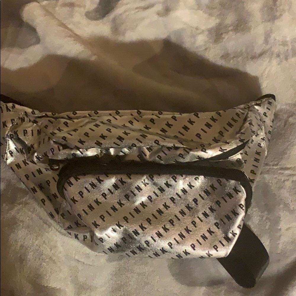 A pink brand fanny pack